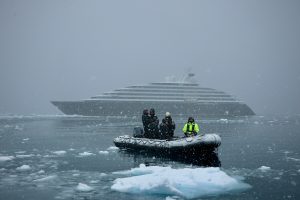 Ship and zodiac boat in Antarctic blizzard